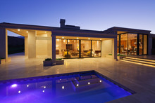View Inside Modern Home With Swimming Pool At Dusk