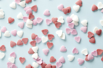 Wall Mural - Decorative hearts on a blue background. Valentine's day decor concept. February 14