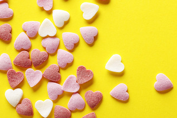 Wall Mural - Decorative hearts on a yellow background. Valentine's day decor concept. February 14