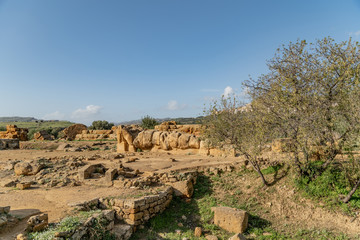 Wall Mural - Giant Telamon, Atlas supporting statue of ruined Temple of Zeus in the Valley of Temples of Agrigento, Sicily, Italy.