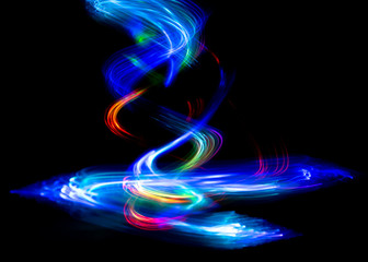 Wall Mural - Abstract color pattern of luminous stripes on a black background, bright and smooth color streaks