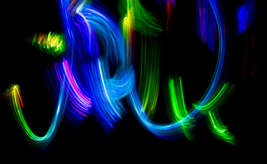 Wall Mural - Abstract color pattern of luminous stripes on a black background, bright and smooth color streaks