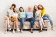 © Prostock-studio - Women Of Different Age Sitting On Sofa Smiling Indoor