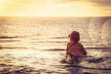 Happy Child Toddler Swimming Infinity Swimming Pool At Sunset As Travel Lifestyle