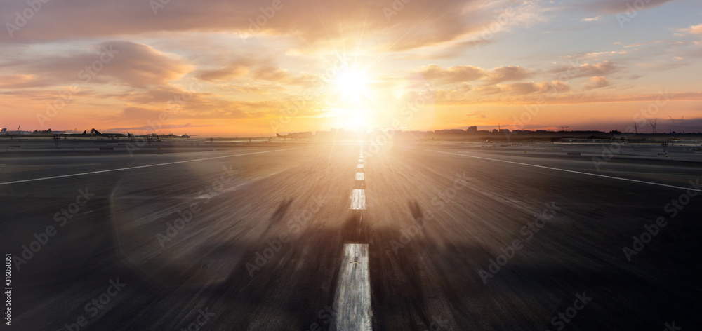 Empty airplane runway with dramatic sunset - obrazy, fototapety, plakaty 