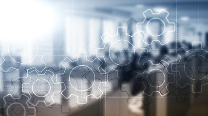 Wall Mural - double exposure gears mechanism on blurred background. business and industrial process automation co