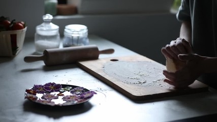 Wall Mural - Woman making cookies with Primula petals