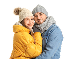 Wall Mural - Portrait of happy couple in winter clothes on white background