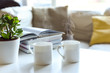 © tommoh29 - Relaxing sofa area with coffee table and hot drink in modern home interior