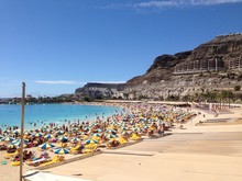 Playa De Amadores Beach In Gran Canaria Island With People Around It In Spain