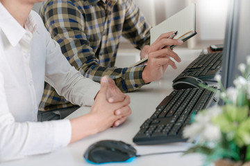pensive programmer working on desktop pc programming code technologies or website design at office s