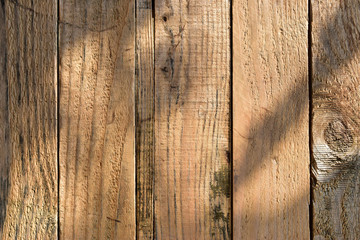 Wall Mural - wood barn wall plank texture background with light and shadow in the morning day, top view of old wooden table