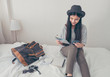 © weedezign - Young asian woman traveller planning vacation holiday expedition on bed.preparing to travel.freedom wanderlust lifestyle