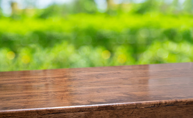 Aufkleber - spring background.Empty diagonal brown wooden table with blur tree in garden boekh background,banner mockup template for display of product