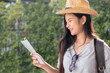 © weedezign - Asian woman traveler backpacker looking for route of place on street in when travel in city,journey trip