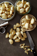 Canvas Print - Garlic with garlic crusher, studio shot 