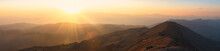 Panorama Of The Mountains At Sunset.