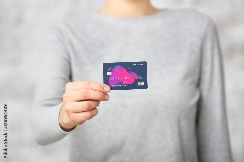 Young woman with credit card, closeup