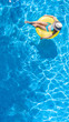 © Iuliia Sokolovska - Active young girl in hat in swimming pool aerial top view from above, child relaxes and swims on inflatable ring donut and has fun in water on family vacation, tropical holiday resort