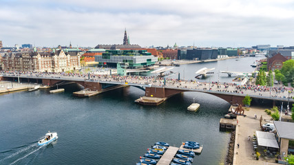 Wall Mural - Marathon running race, aerial view of many runners on bridge from above, road racing, sport competition, Copenhagen marathon, Denmark