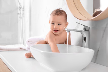 Sticker - Cute little baby playing in bathroom at home