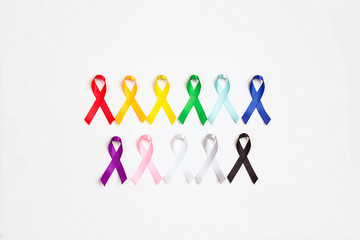 Wall Mural - World cancer day concept, February 4. Colorful awareness ribbons on white background.