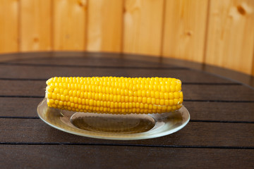 Wall Mural - Boiled corn on a  wooden table.