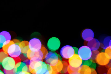 rainbow bokeh christmas lights background with place for text