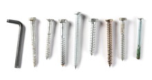 Metal nails, screws and bolts pile isolated on white background, top view