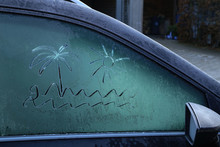 Drawing On Frozen Car Windows On A Frosty Morning