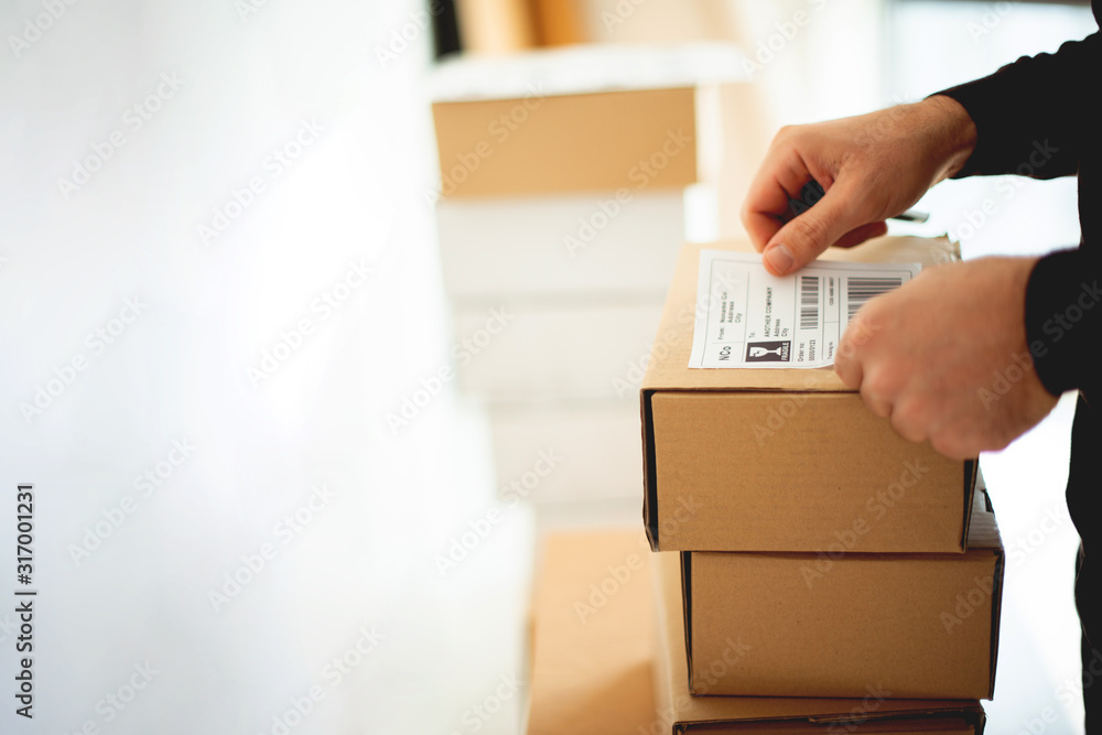 Delivery service, applying a shipping label	