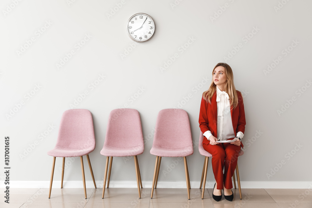 Young woman waiting for job interview indoors - obrazy, fototapety, plakaty 
