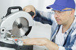 © auremar - man carpenter using a circular saw