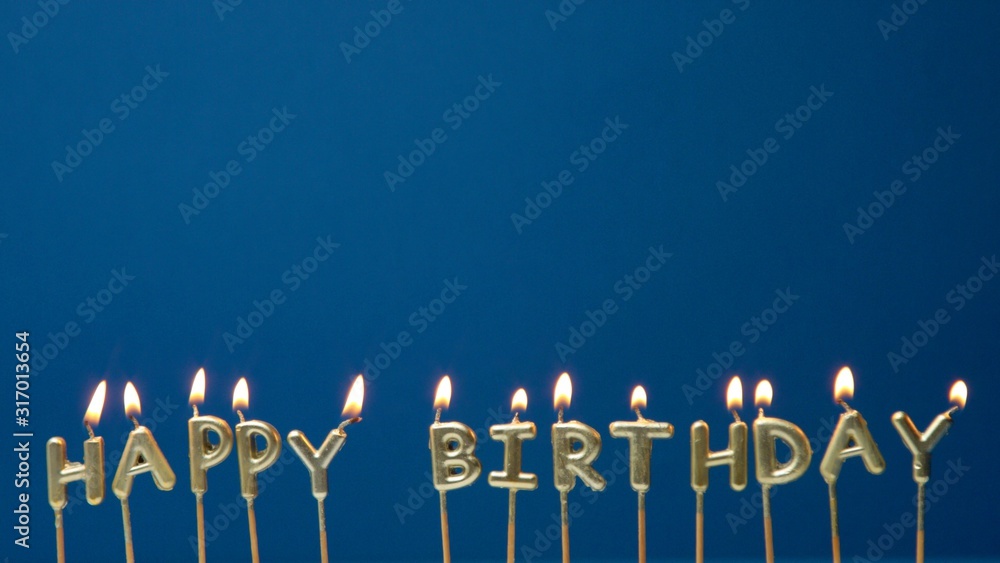 candles Happy birthday with a light on deep blue background Stock Photo ...