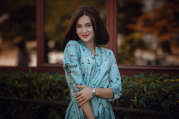 Wall Mural - Fashion portrait of young stylish woman walking on the street