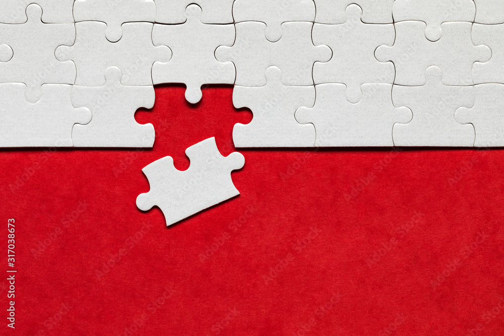 Closeup of jigsaw puzzle isolated. Missing jigsaw puzzle piece, business concept for completing the puzzle piece. Group of puzzle and a puzzle piece. Teamwork concept. Think difference concept.