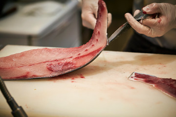 Wall Mural - Filleting fish at fish market 