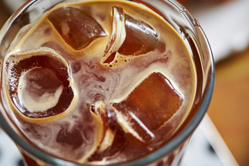 Poster - Iced coffee in glass with ice cube 