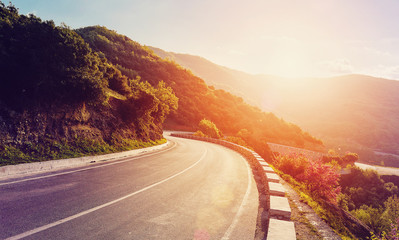 Aufkleber - Mountain road. beautiful asphalt road in the evening in summer during sunset. Vintage toning. Travel background. Highway in mountains. Meteora Region. Greece