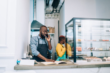 Black workers of modern cafe in city