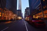 Fototapeta  -  Night street view and city life on  Sixth Avenue or Avenue of the Americas, Midtown Manhattan, New York.