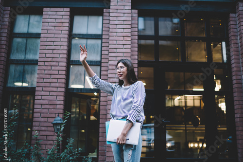 Fotografía Happy Latino woman with education equipment for university exam preparation stan