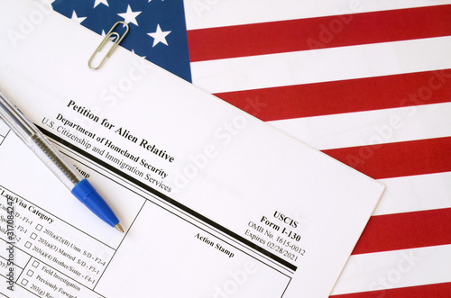 Cuadros en Lienzo I-130 Petition for alien relative blank form lies on United States flag with blu