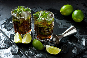 Wall Mural - Cool  Cuba libre  in glasses on  dark table, holidays party concept