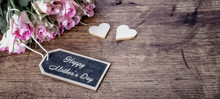 Happy Mother's Day Background Vintage - Bouquet Of Pink Roses On Rustic Wooden Table And Two Wooden Hearts, With Space For Text