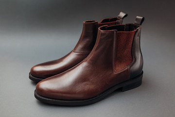 Shoes, chelsea leather boots for men. Male winter, autumn or spring fashion. Footwear on grey background. Sale