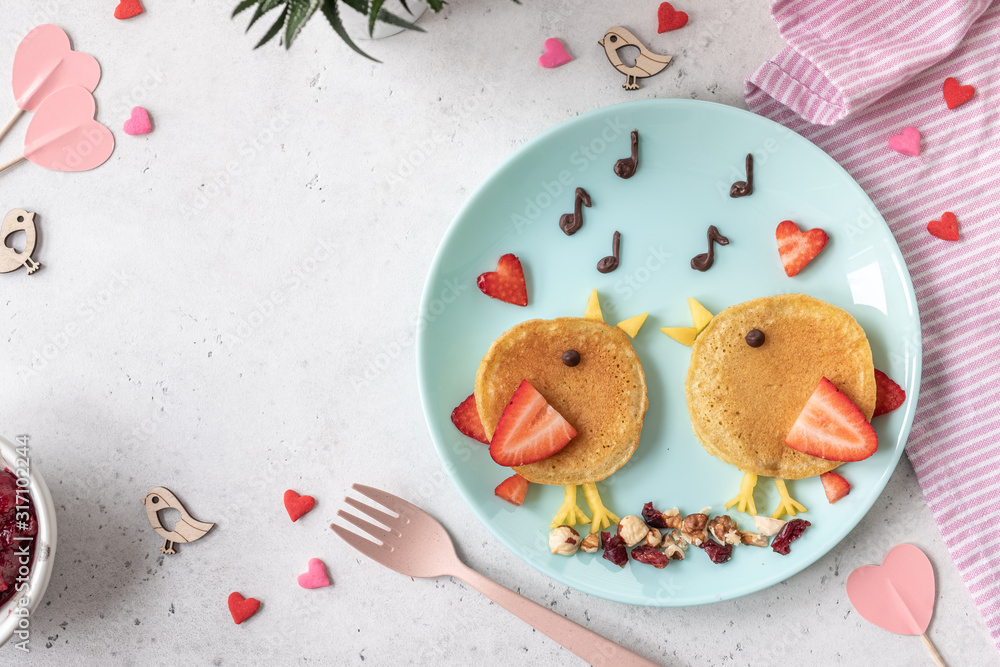 Creative idea for kids breakfast - funny pancakes shaped cute birds - obrazy, fototapety, plakaty 