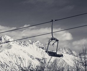 Ski lift in snow winter mountains at nice sunny day