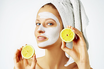 Wall Mural - cosmetology, skin care, face treatment, spa and natural beauty concept. woman with facial mask holds