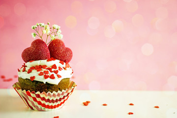 Canvas Print - Valentines day cupcake. Cupcake with white cream and red sugar hearts on a pink background, bokeh effect, copy space. St. Valentine's Day card